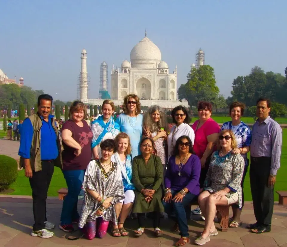 A retreat group posed together in front of the Taj Mahal