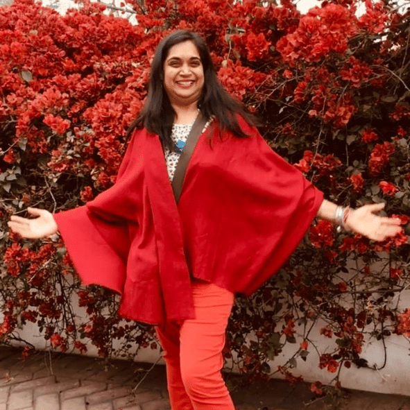 Bhavna, The Golden Light, wearing a red outfit Bhavna, The Golden Light, wearing a red outfit